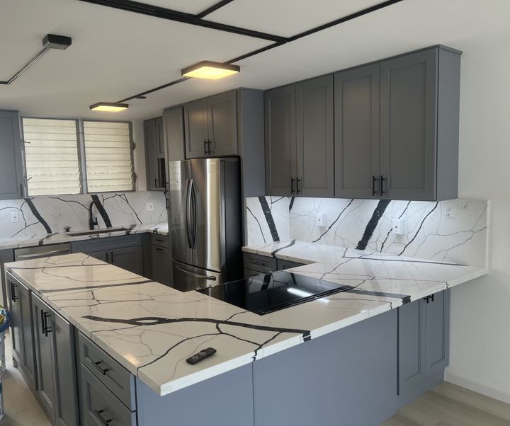 Kitchen with Bold-Vein Quartz Waterfall Island — photo 1